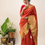 Orange Red Kanjivaram Silk Saree With Floral Buttis