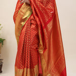 Orange Red Kanjivaram Silk Saree With Floral Buttis