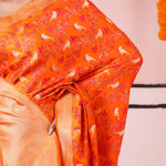 Vivid Orange Banarasi Satin Saree With Floral-Fauna Elegance