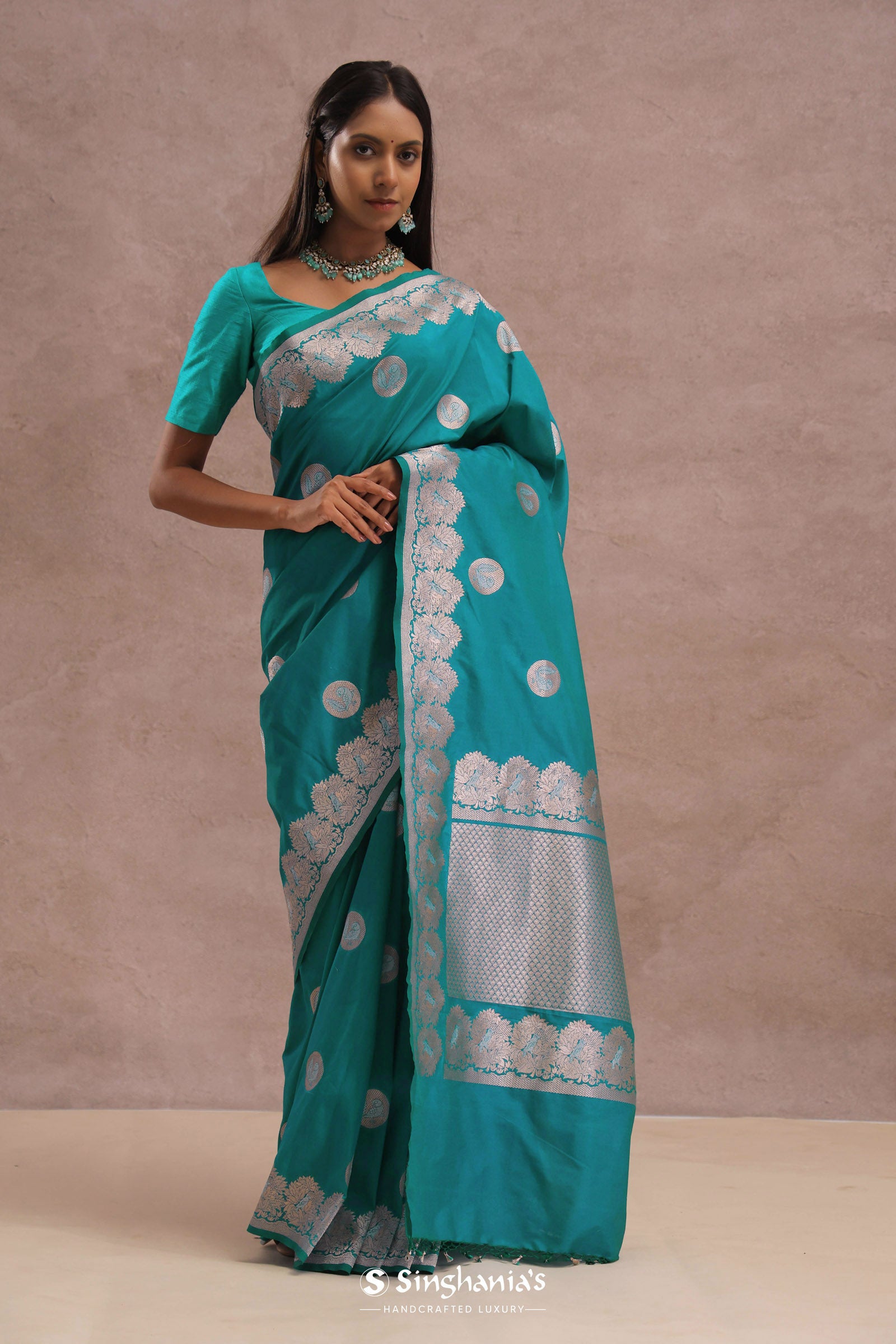Teal Blue Banarasi Saree With Gold And Silver Zari Border