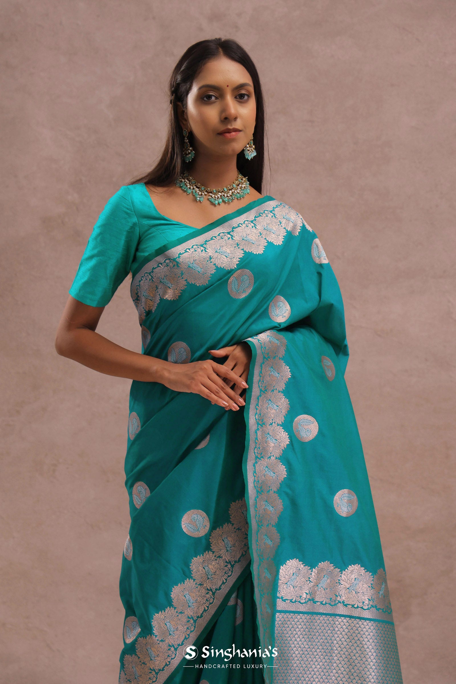 Teal Blue Banarasi Saree With Gold And Silver Zari Border
