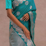 Teal Blue Banarasi Saree With Gold And Silver Zari Border