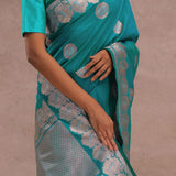Teal Blue Banarasi Saree With Gold And Silver Zari Border
