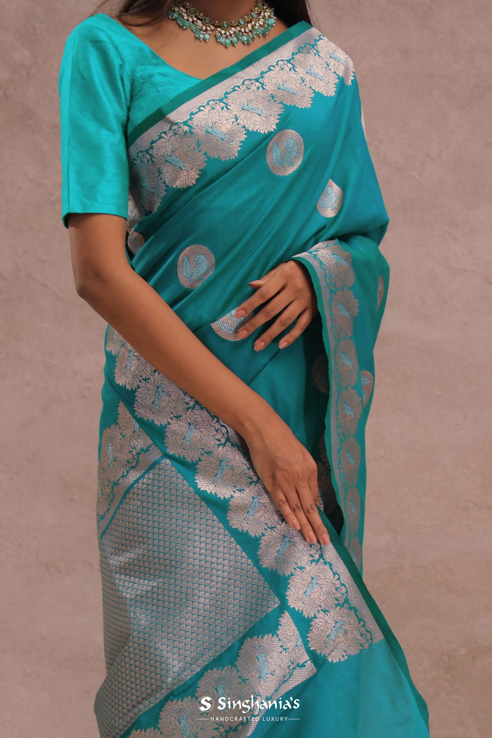 Teal Blue Banarasi Saree With Gold And Silver Zari Border
