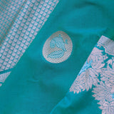 Teal Blue Banarasi Saree With Gold And Silver Zari Border