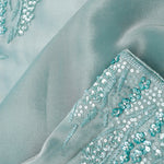 Light Turquoise Tissue Saree With Embroidery Detail