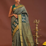 Dark Green Kanjivaram Saree With Leaf Jaal And Gold Zari Border