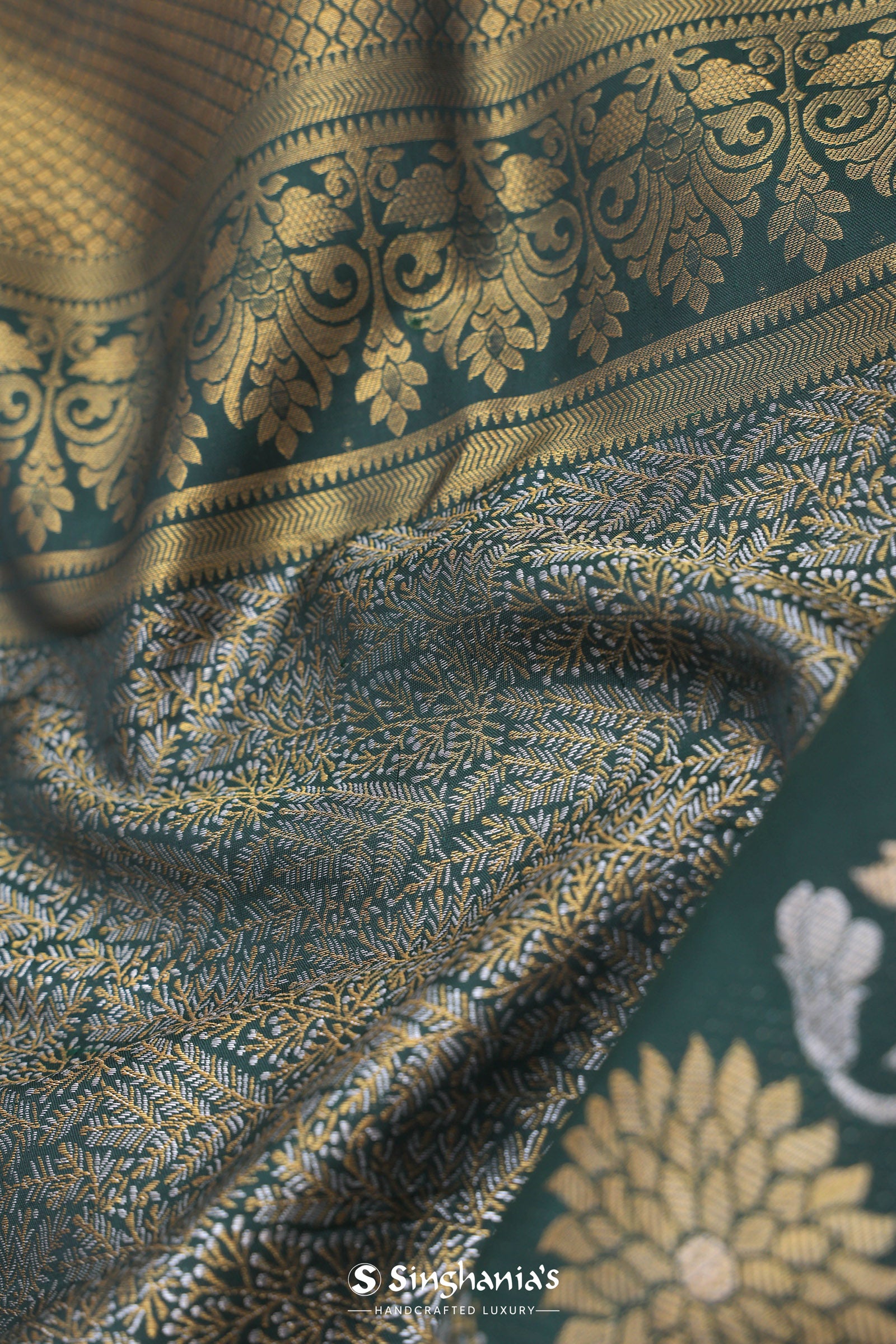 Dark Green Kanjivaram Saree With Leaf Jaal And Gold Zari Border