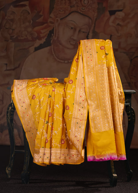 <img> Vibrant Yellow Banarasi Silk Saree Adorned With Floral Embroidery