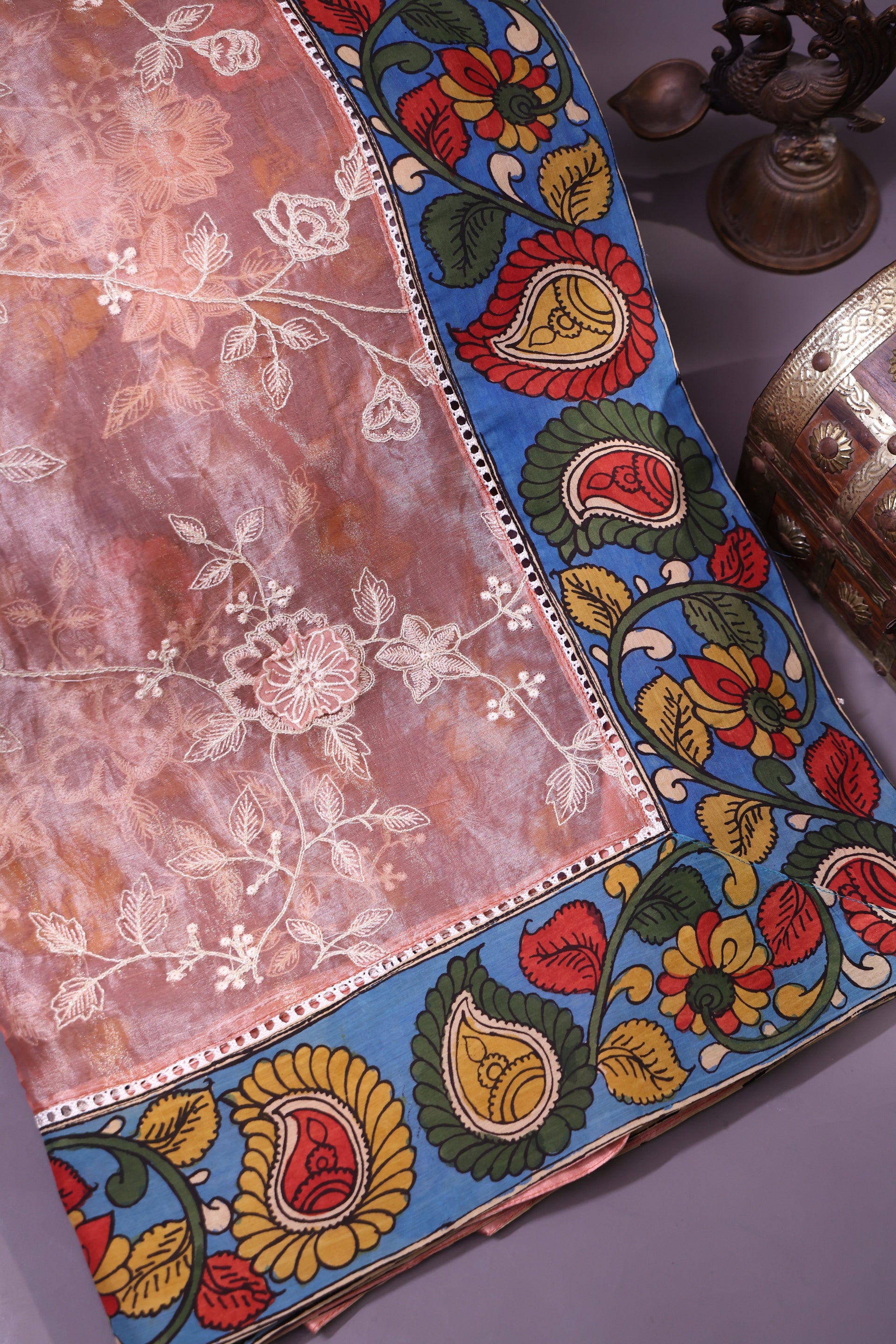 <img> Elegant Peach-Toned Organza Saree Adorned With Delicate Floral Embroidery