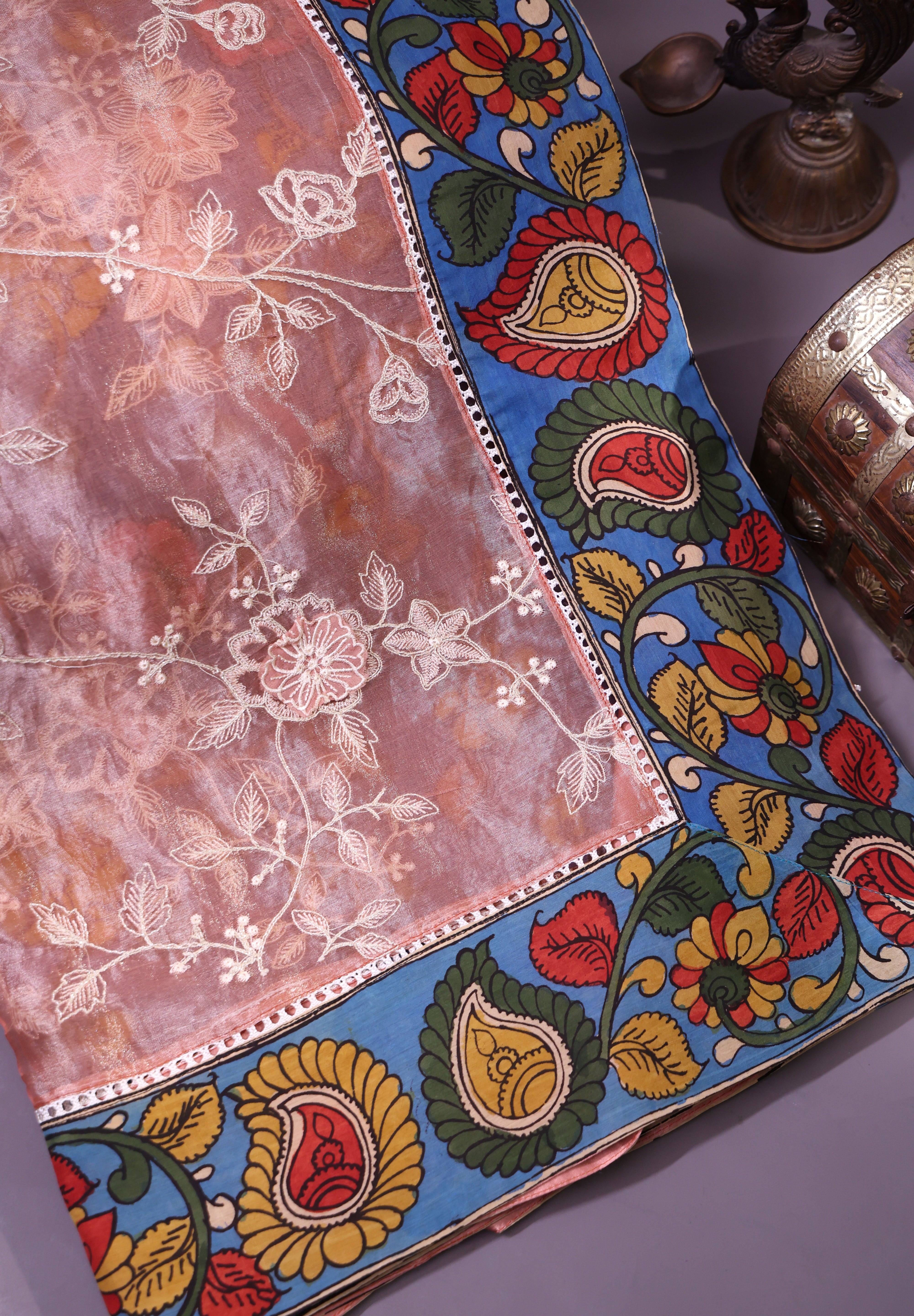 Elegant Peach-Toned Organza Saree Adorned With Delicate Floral Embroidery