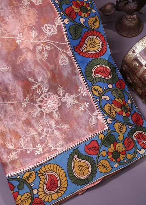 <img> Elegant Peach-Toned Organza Saree Adorned With Delicate Floral Embroidery