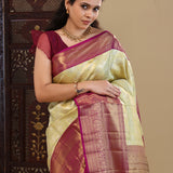 Pastel Green Kanjivaram Saree With Contrast Border.
