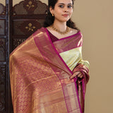 Pastel Green Kanjivaram Saree With Contrast Border.