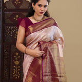 Pastel Pink Kanjivaram Saree With Contrast Border.