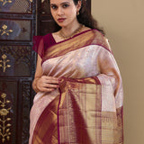Pastel Pink Kanjivaram Saree With Contrast Border.
