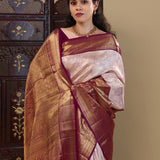 Pastel Pink Kanjivaram Saree With Contrast Border.