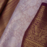 Pastel Pink Kanjivaram Saree With Contrast Border.
