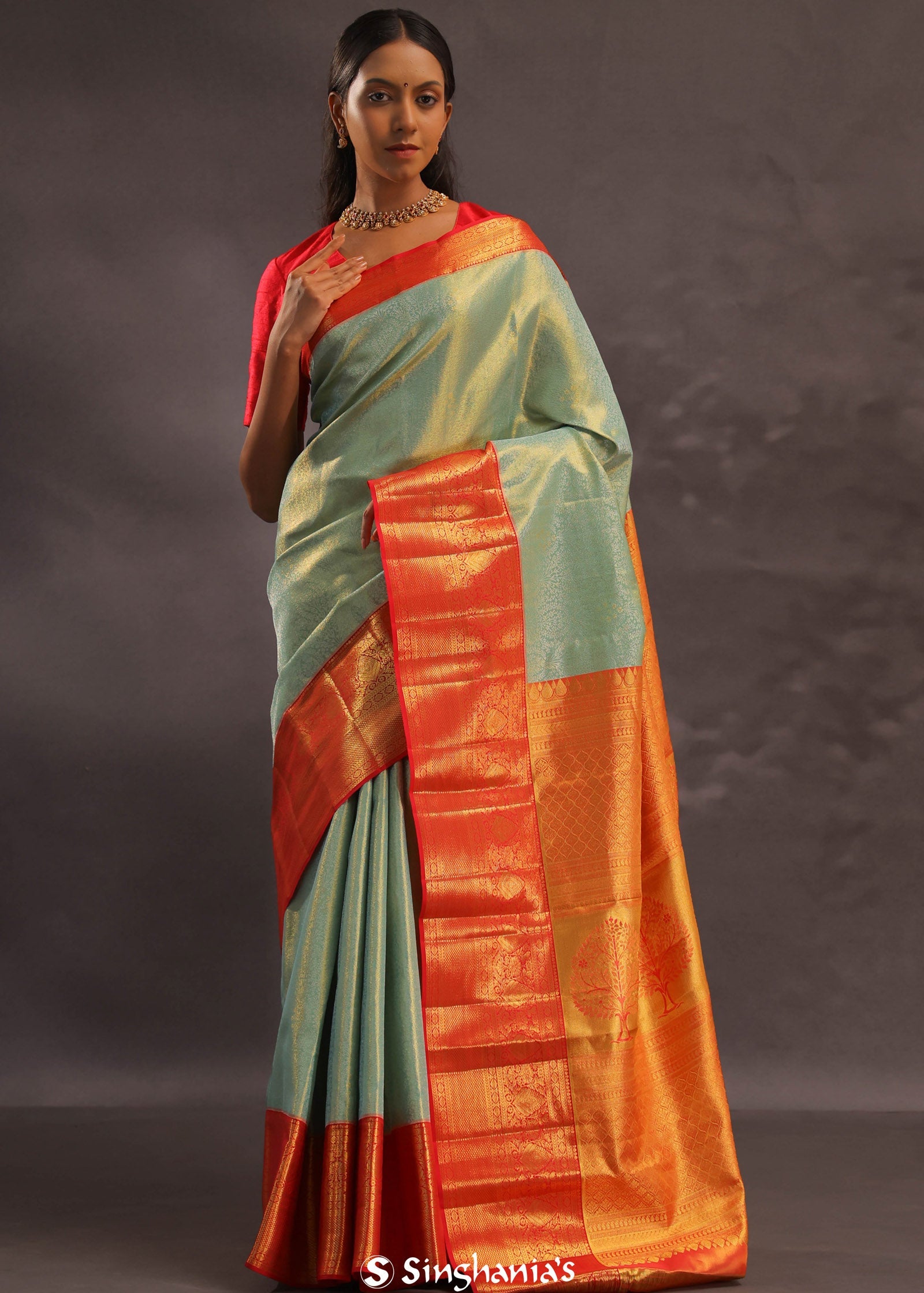 Pistachio Green Kanjivaram Tissue Silk Saree With Vibrant Orange Border