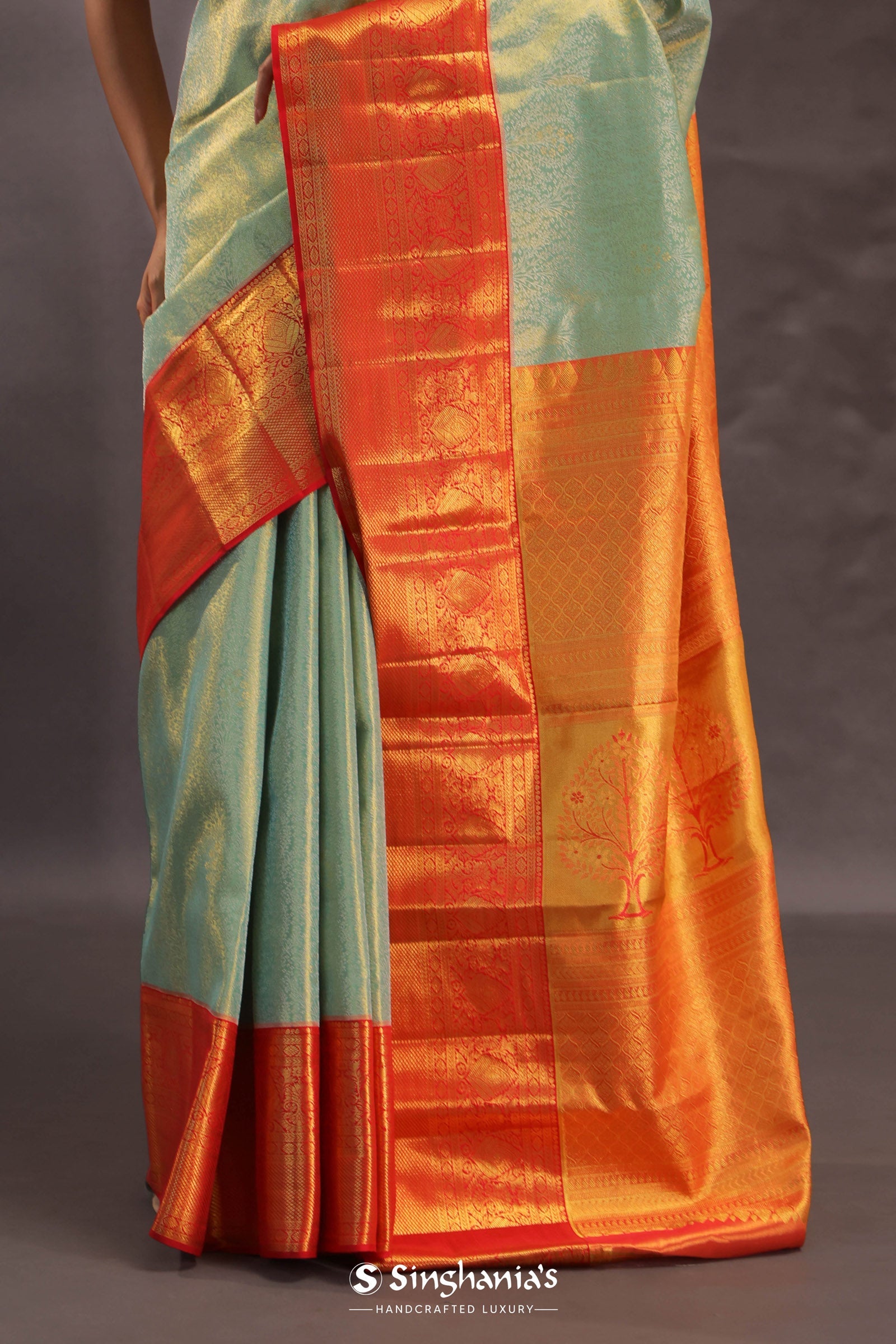 Pistachio Green Kanjivaram Tissue Silk Saree With Vibrant Orange Border