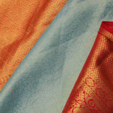 Pistachio Green Kanjivaram Tissue Silk Saree With Vibrant Orange Border