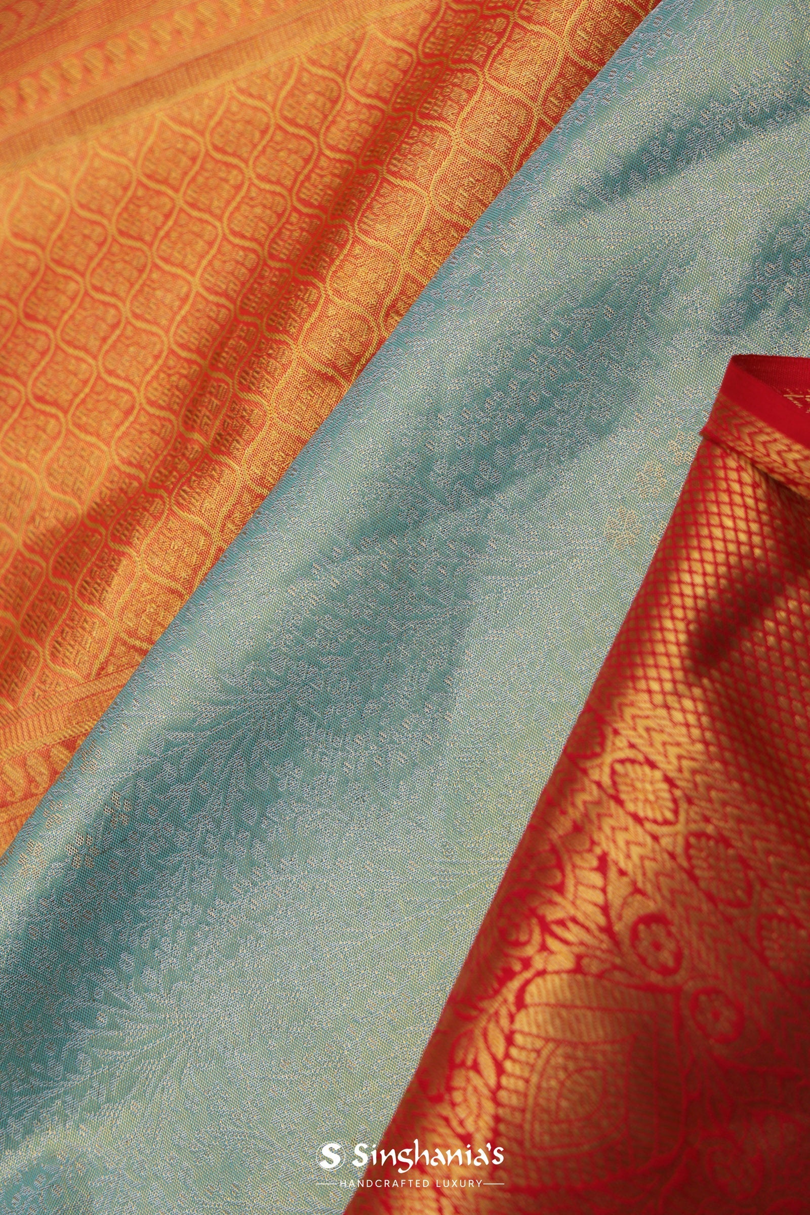 Pistachio Green Kanjivaram Tissue Silk Saree With Vibrant Orange Border