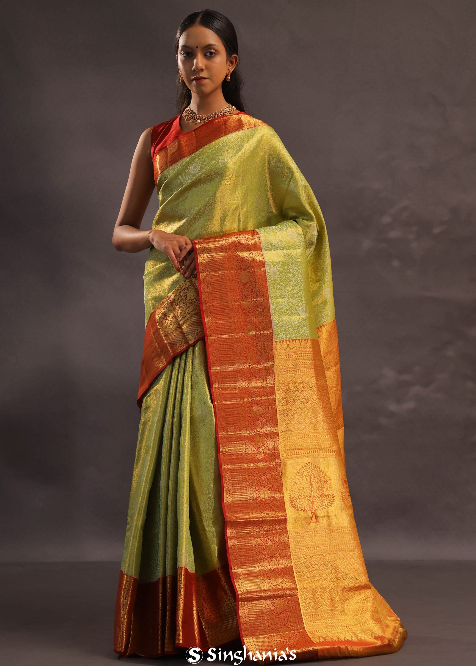 Soft Lime Green Kanjivaram Tissue Silk Saree With Bright Orange Border