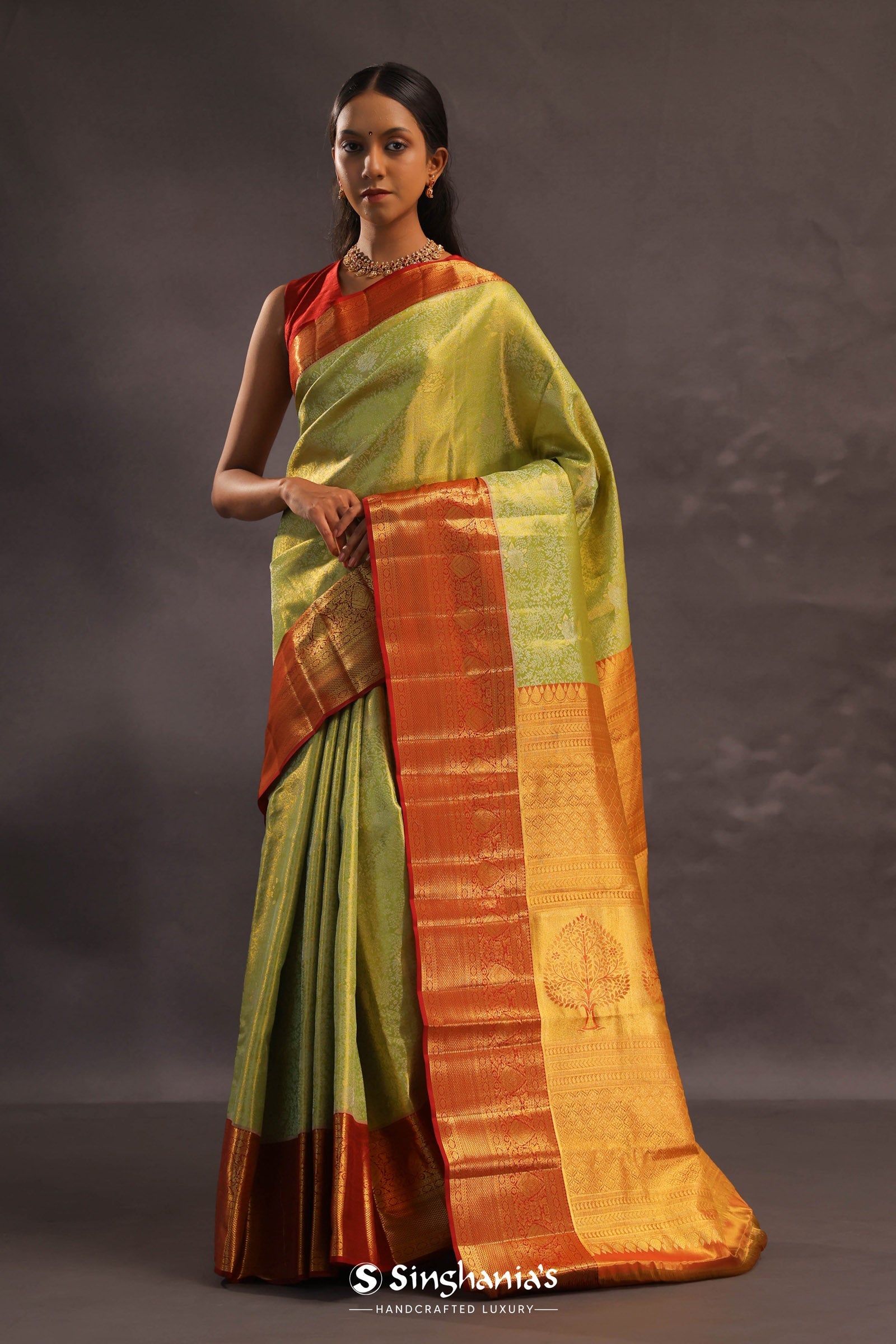 Soft Lime Green Kanjivaram Tissue Silk Saree With Bright Orange Border