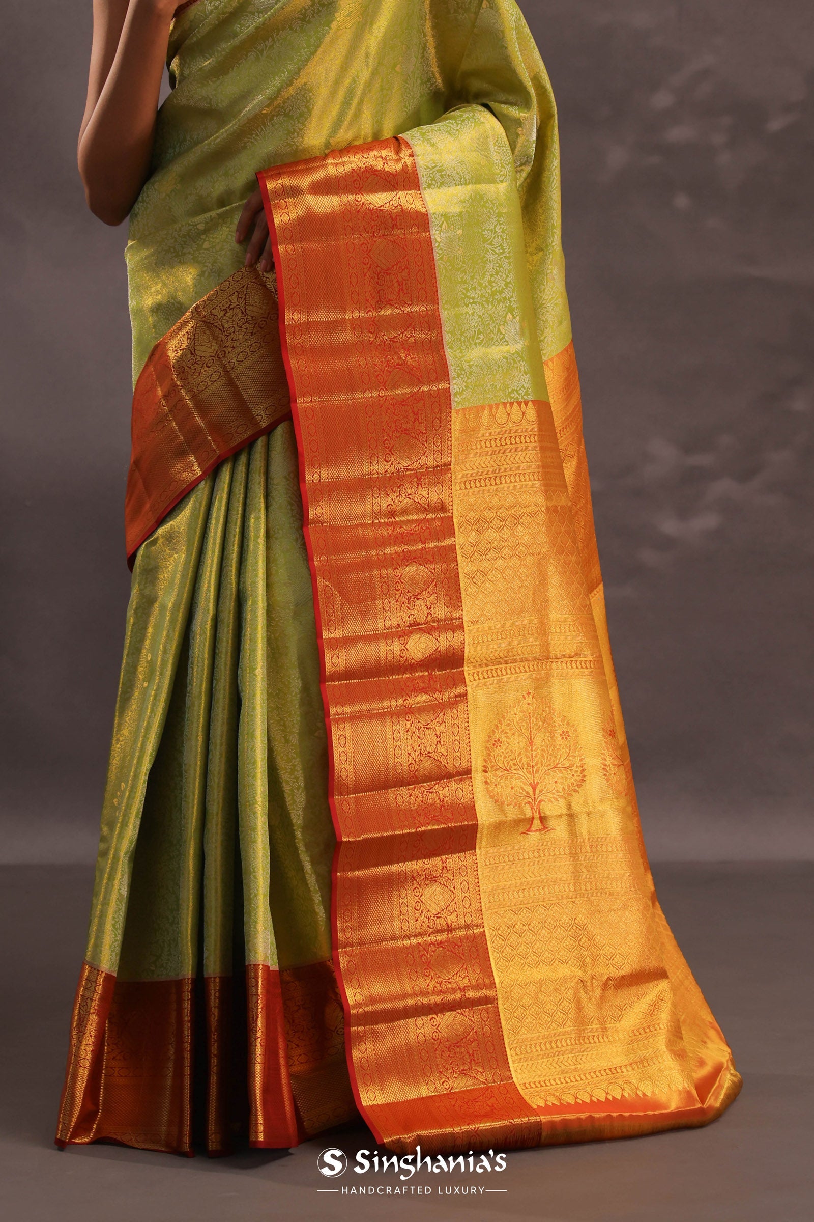Soft Lime Green Kanjivaram Tissue Silk Saree With Bright Orange Border