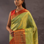 Soft Lime Green Kanjivaram Tissue Silk Saree With Bright Orange Border