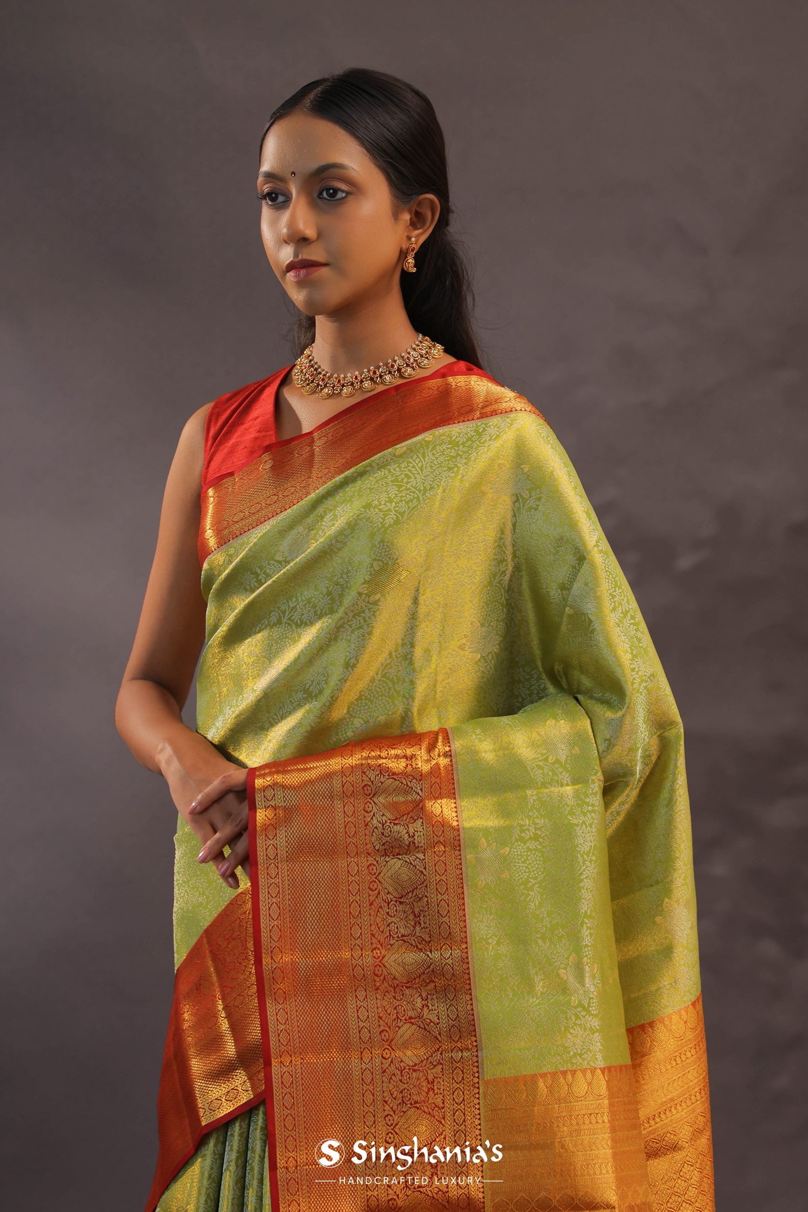 Soft Lime Green Kanjivaram Tissue Silk Saree With Bright Orange Border