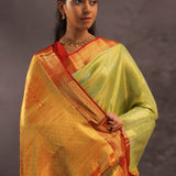Soft Lime Green Kanjivaram Tissue Silk Saree With Bright Orange Border