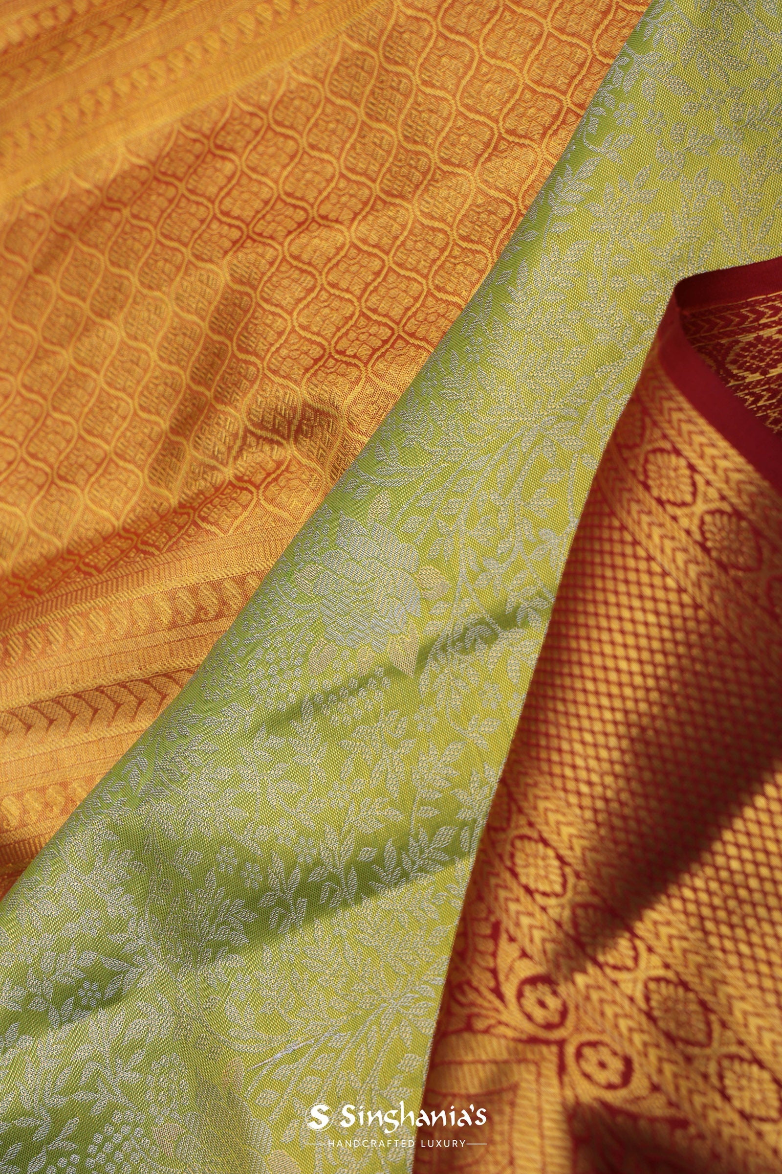 Soft Lime Green Kanjivaram Tissue Silk Saree With Bright Orange Border