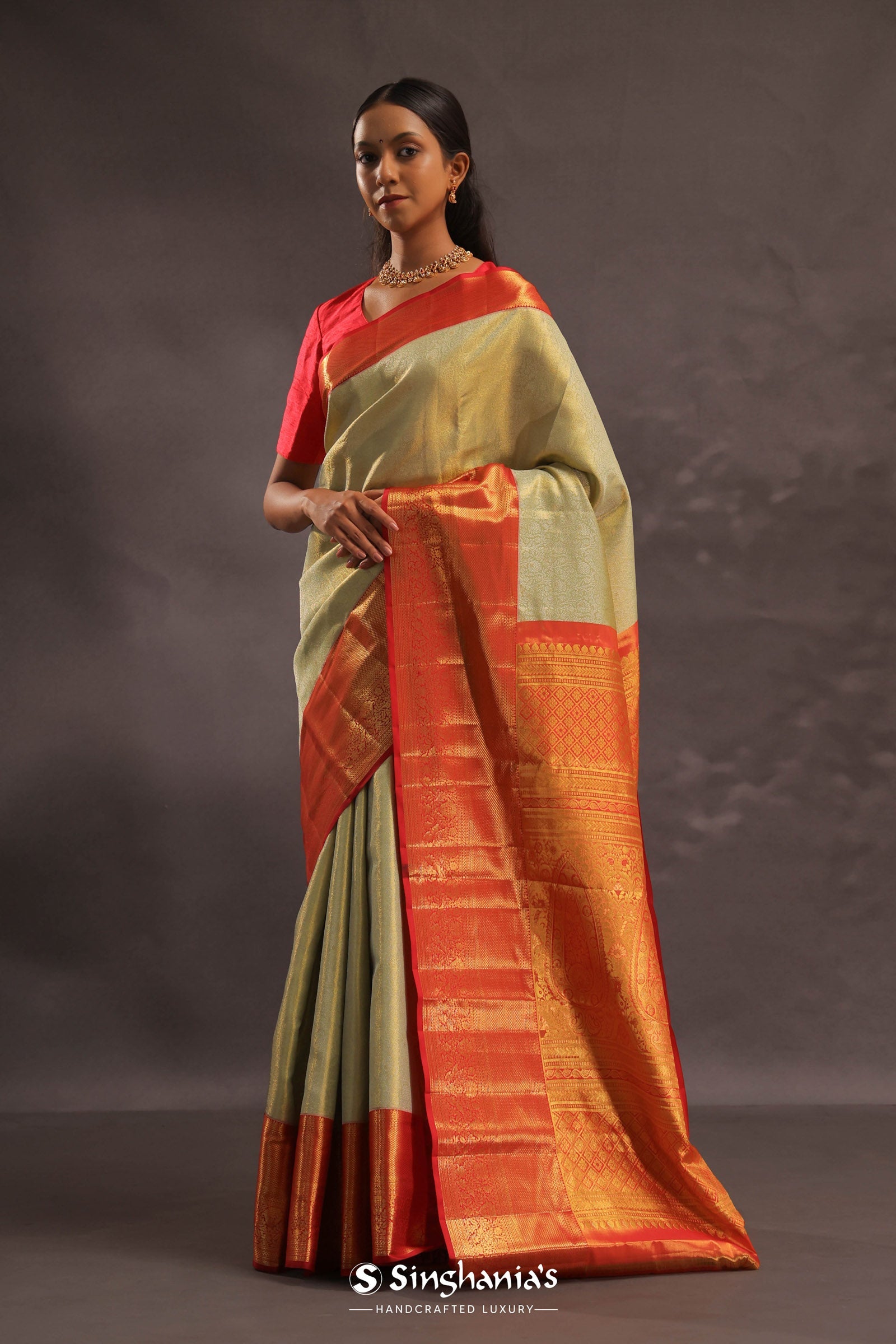 Soft Olive Kanjivaram Tissue Slik Saree With Vibrant Orange Border