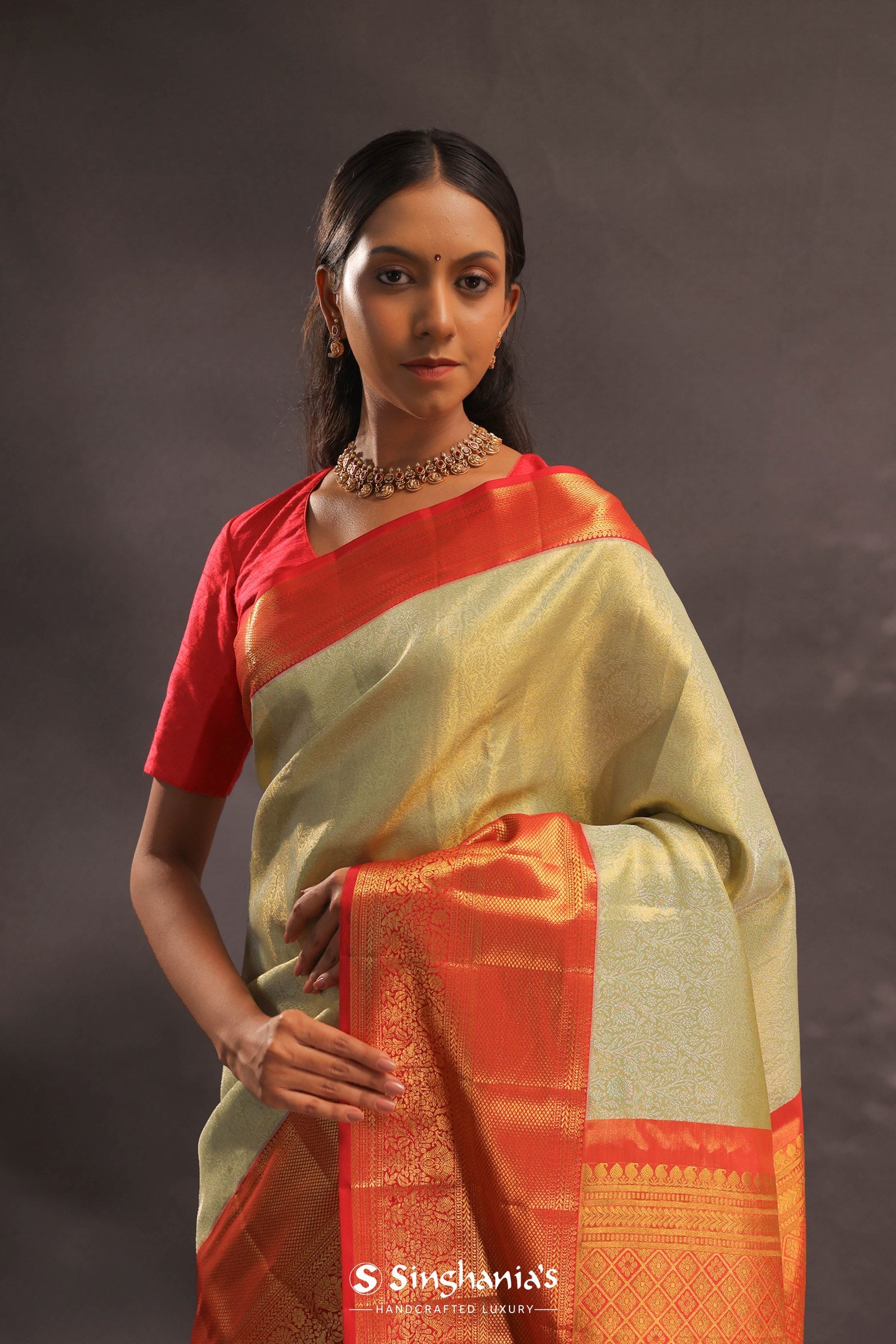 Soft Olive Kanjivaram Tissue Slik Saree With Vibrant Orange Border