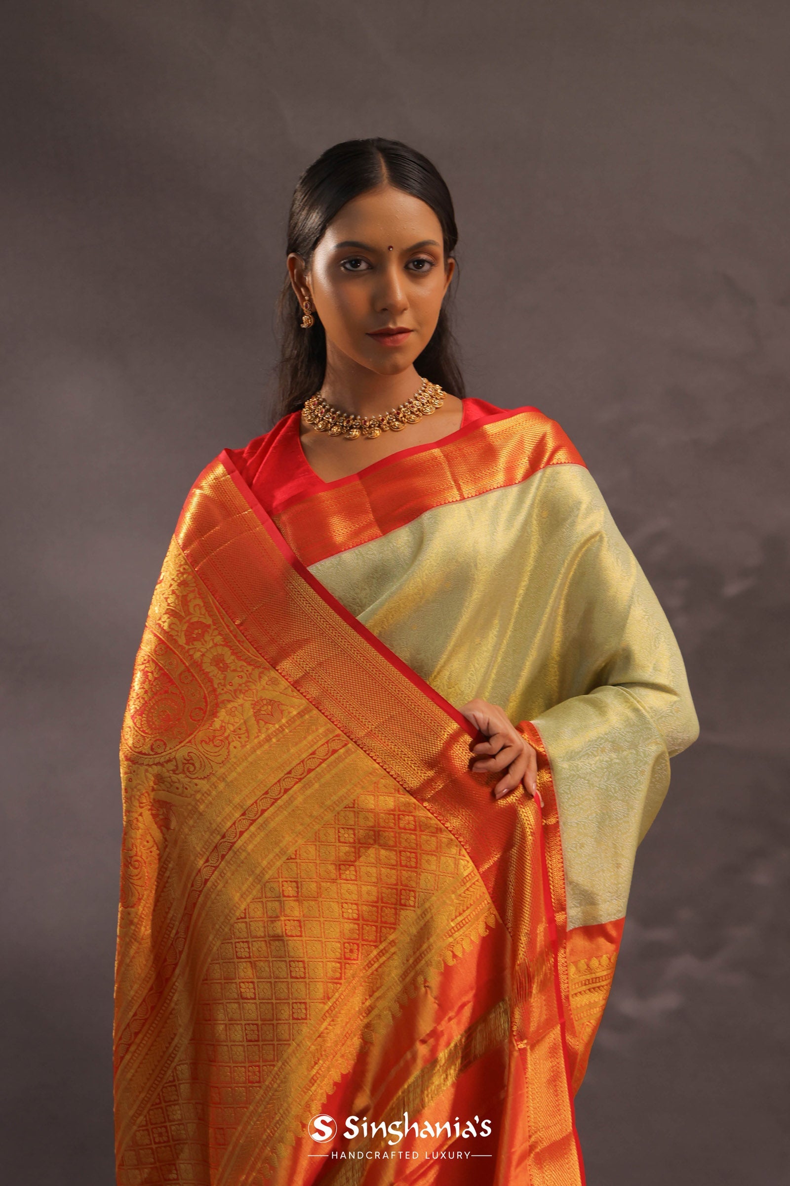 Soft Olive Kanjivaram Tissue Slik Saree With Vibrant Orange Border