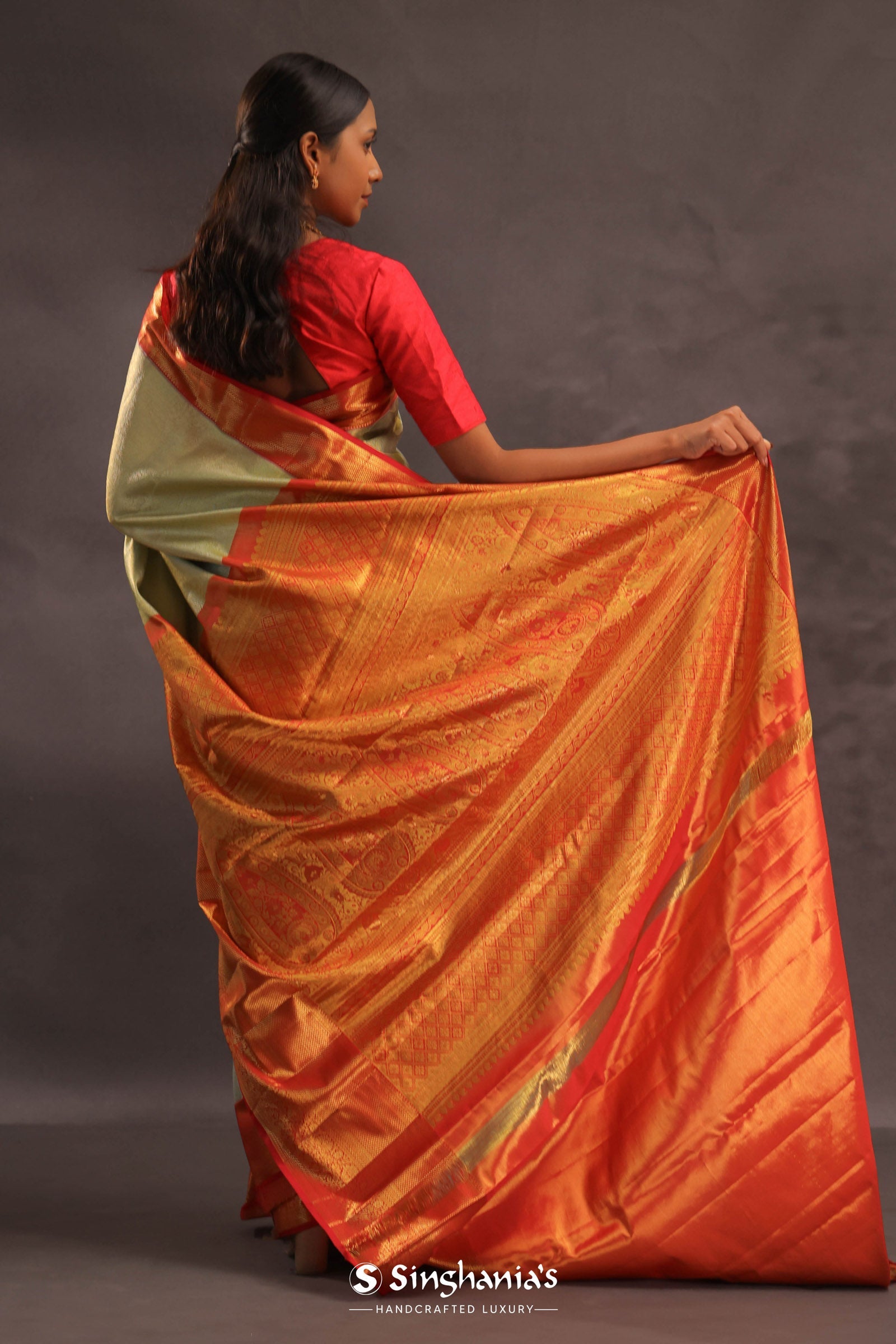 Soft Olive Kanjivaram Tissue Slik Saree With Vibrant Orange Border