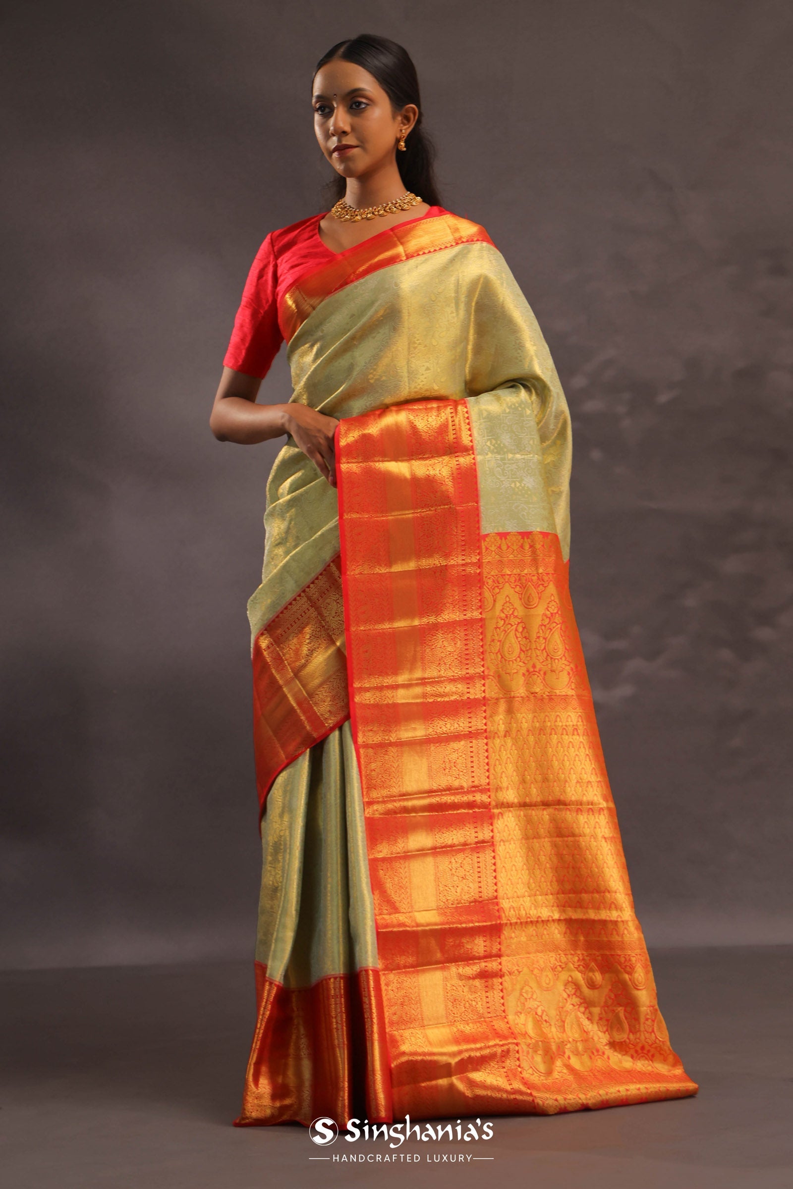 Dark Cream Kanjivaram Tissue Silk Saree With Vibrant Orange Border