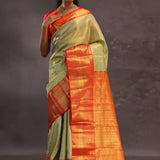 Dark Cream Kanjivaram Tissue Silk Saree With Vibrant Orange Border