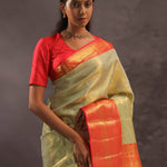 Dark Cream Kanjivaram Tissue Silk Saree With Vibrant Orange Border