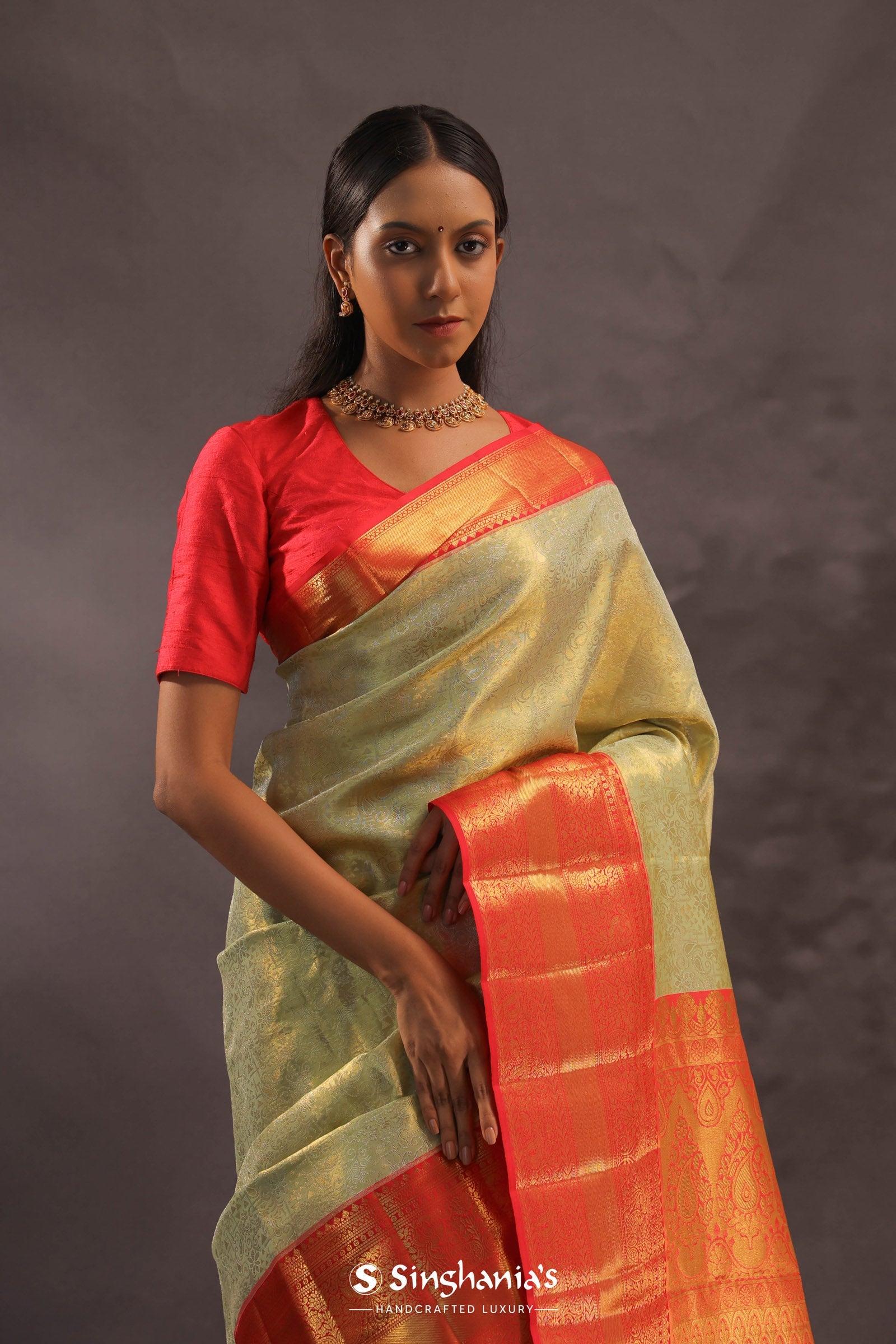 Dark Cream Kanjivaram Tissue Silk Saree With Vibrant Orange Border