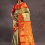 Beige Kanjivaram Tissue Silk Saree With Contrast Vibrant Orange Border