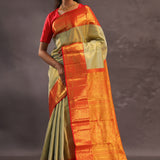 Beige Kanjivaram Tissue Silk Saree With Contrast Vibrant Orange Border