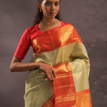 Beige Kanjivaram Tissue Silk Saree With Contrast Vibrant Orange Border