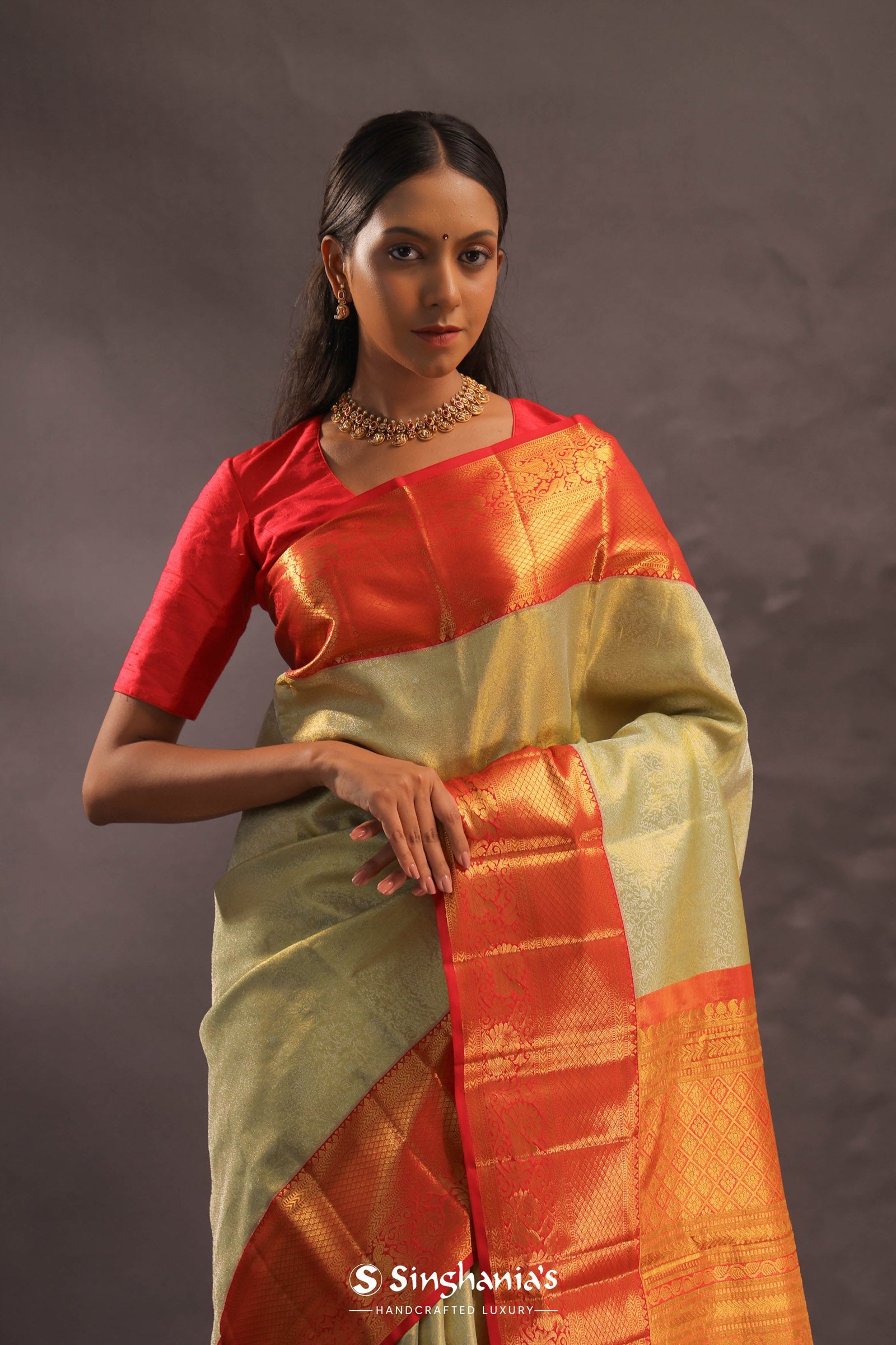 Beige Kanjivaram Tissue Silk Saree With Contrast Vibrant Orange Border