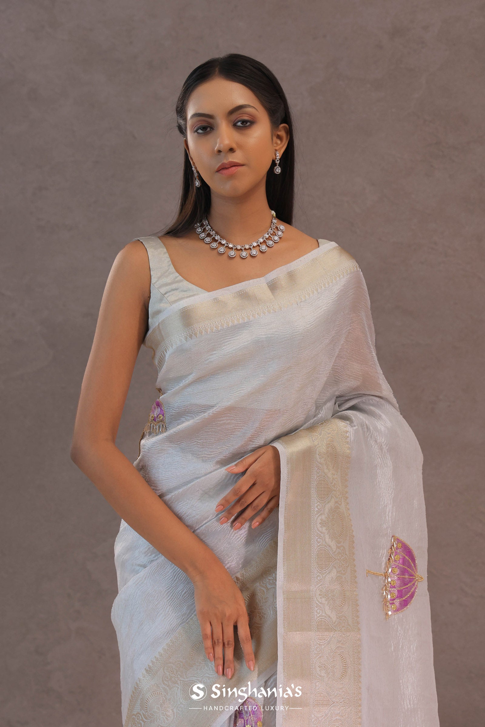 White Crush Tissue Saree With Purple Butta'S