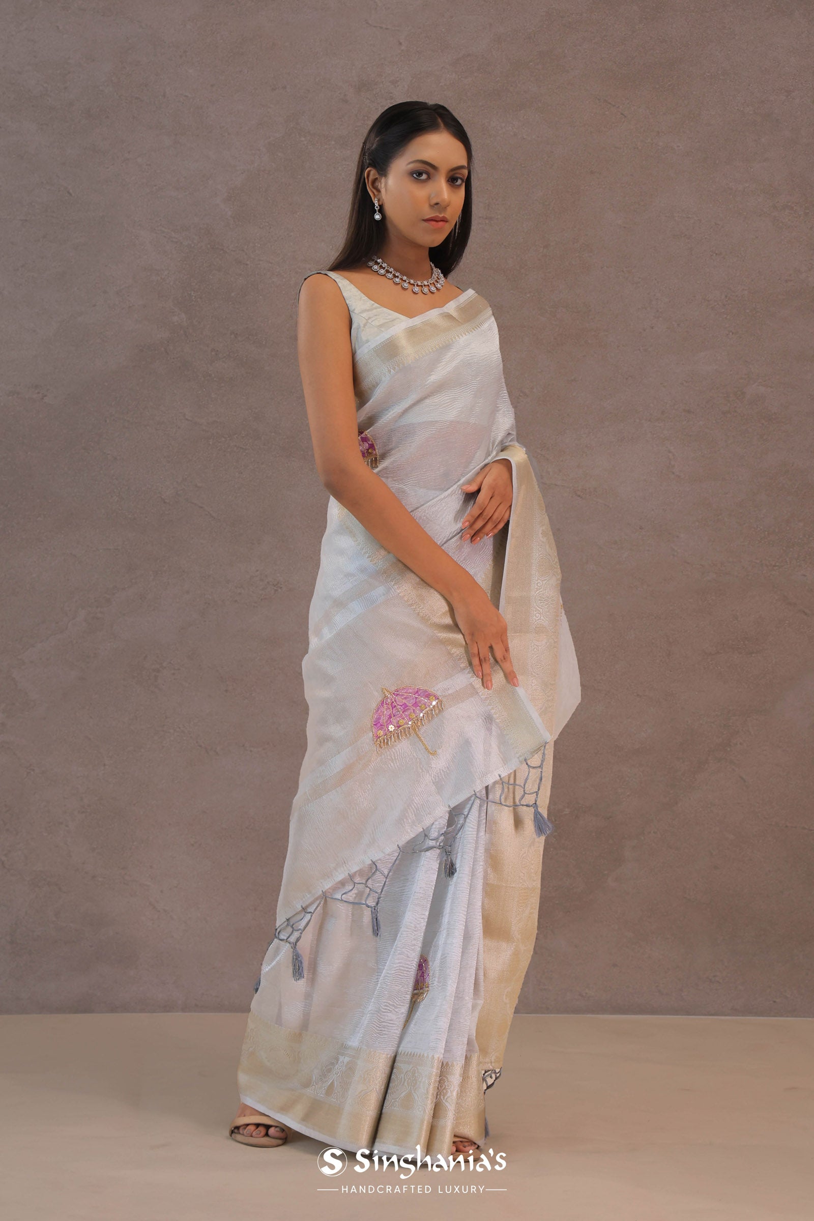 White Crush Tissue Saree With Purple Butta'S