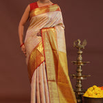 Soft Pink Kanjivaram Tissue Saree With Contrast Red Border