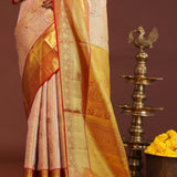 Soft Pink Kanjivaram Tissue Saree With Contrast Red Border