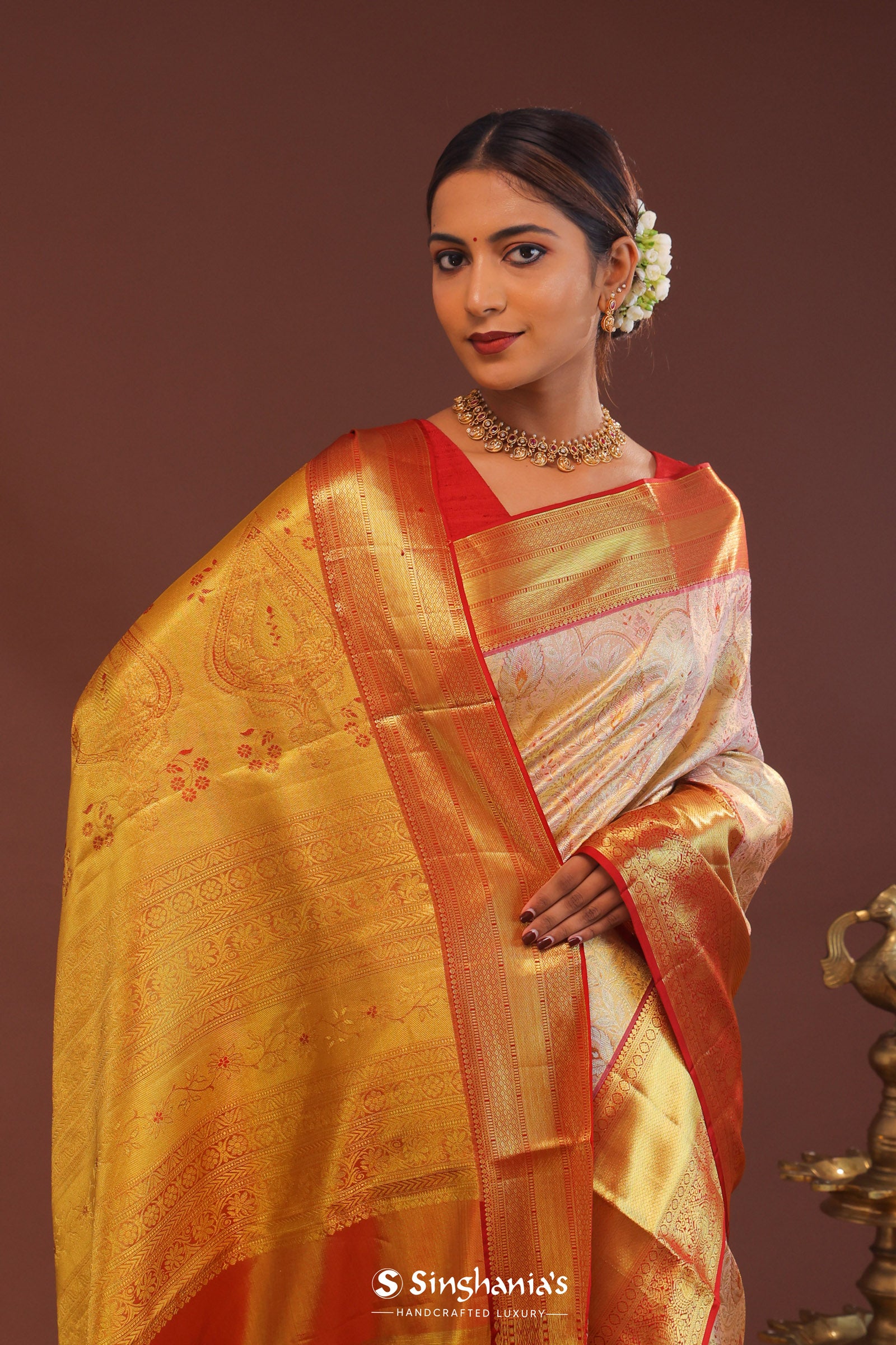 Soft Pink Kanjivaram Tissue Saree With Contrast Red Border